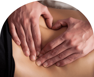 Hands forming heart on bare lower back