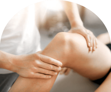 Hands performing knee massage therapy